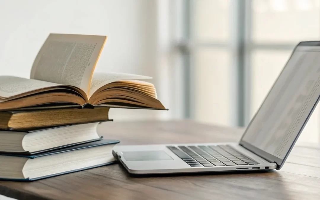 A laptop and an open bible on a desk for a free metaphysical bible study.