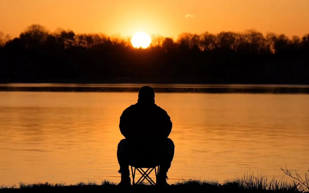 Serene sunrise meditation scene representing spiritual healing and the removal of spiritual blockages