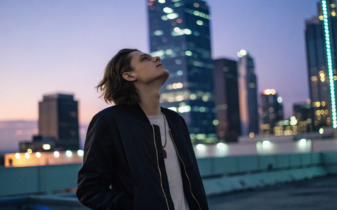 Person on a rooftop at dusk wondering why they're still anxious after so much spiritual work.