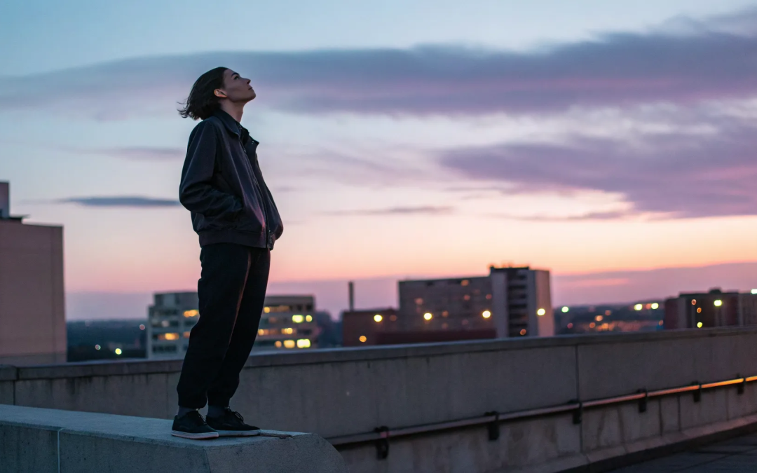 A person on a rooftop finds a personal relationship with God without religion.